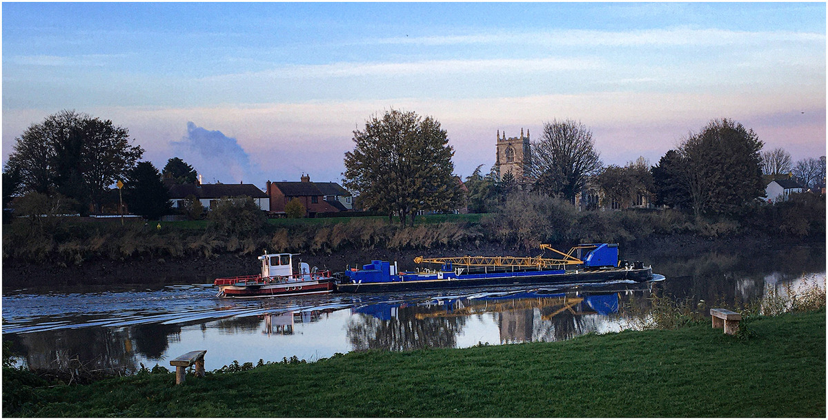 Barge Disturbs the Winter Trent's Peaceful Reflections